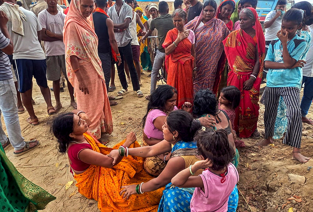 Family members mourn after four children drown in Patna