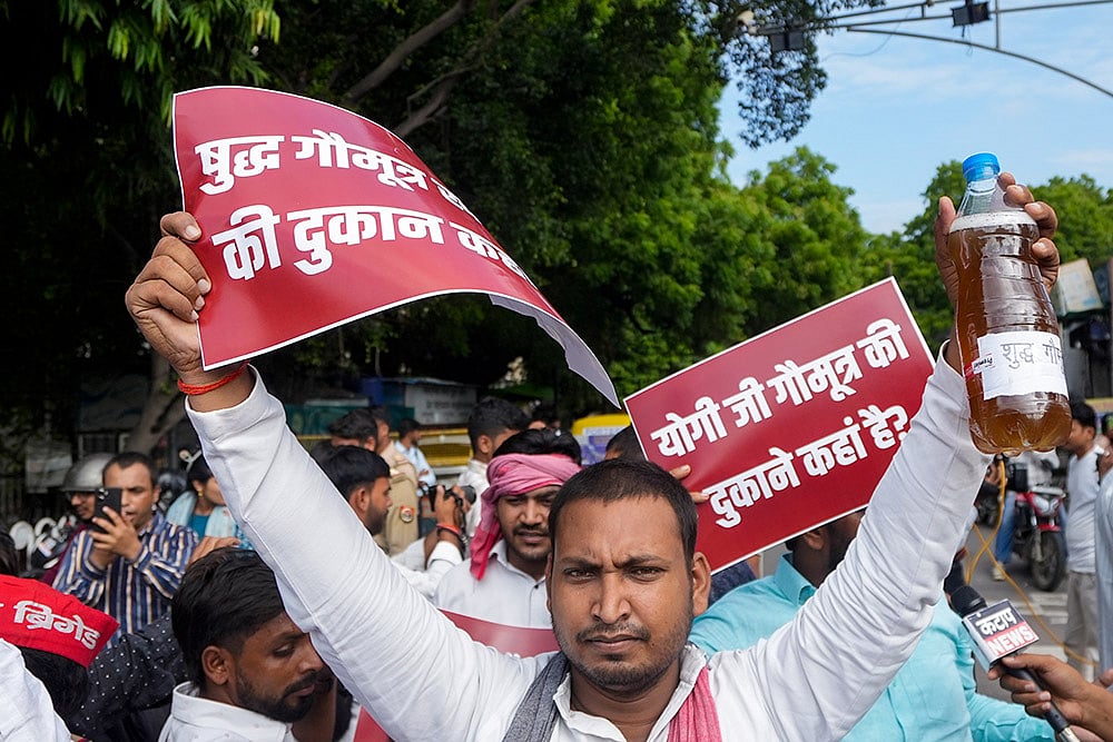 SP workers protest against UP govts pilot project