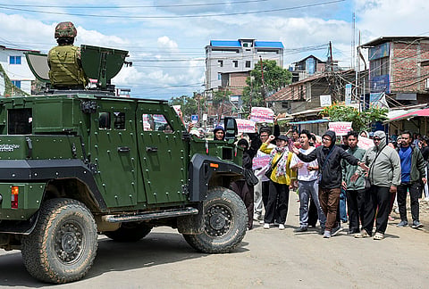 Demonstrators block the movement of security personnel and vehicles on the second day of a 48-hour statewide strike called by Campaign for Just and Free Delimitation (JFD) demanding NRC implementation before the census, at Lamlong area in Imphal East district, Manipur.