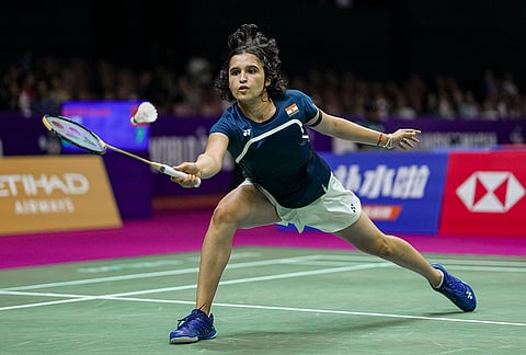 India’s Unnati Hooda competes against Canada’s Michelle Li, unseen, in the women’s doubles round of 32 during the BWF World Championships, at IGI Stadium in New Delhi.