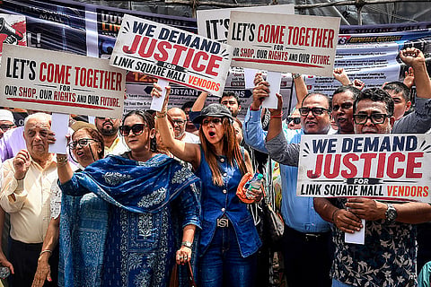 Shop owners of Link Square Mall stage a protest demanding immediate action, an insurance survey and repairs, 16 months after a fire shut the mall, in Bandra West, Mumbai.