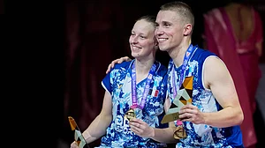(AP Photo/Manish Swarup) : France's Delphine Delrue, left, and Thom Gicquel pose for a photograph with their gold medals after winning against China's Feng Yan Zhe and Huang Dong Ping in the mixed doubles final match of the Badminton World Championships in New Delhi, India, Sunday, Aug. 23, 2026
