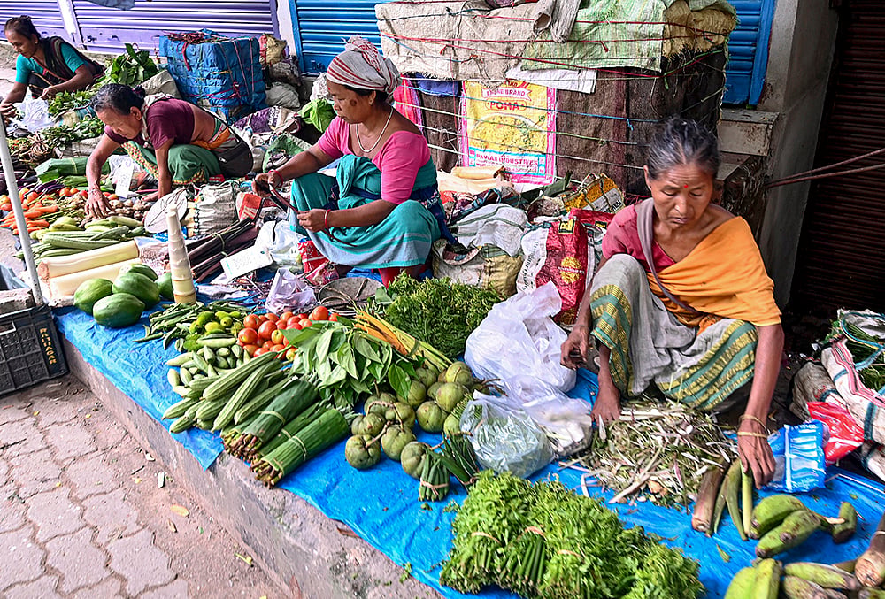 Tribal women sell vegetables amid price hike in Guwahati