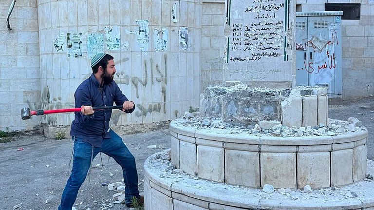 Far-right Israeli lawmaker Zvi Sukkot strikes Palestinian monument - X@tzvisuccot
