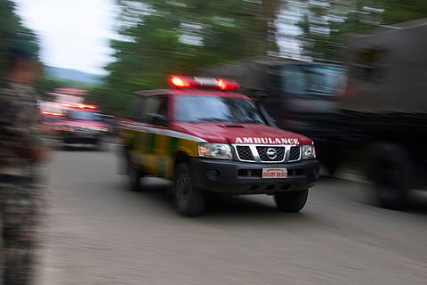 Ambulances carrying people injured during flash flooding head to a hospital in Nepal's Nuwakot district.