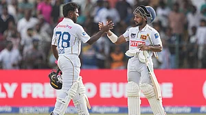 Eranga Jayawardena/AP Photo : Sri Lanka's Sonal Dinusha, right, and Sri Lanka's Asitha Fernando cheers each others at the end of the day five of the second cricket test match between Sri Lanka and India in Colombo, Sri Lanka.