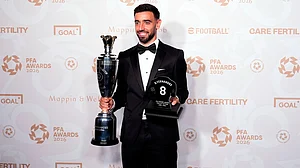 Peter Byrne/AP Photo : Bruno Fernandes with his PFA players player of the year award during the PFA Awards 2026 at Manchester Opera House, Manchester, England.