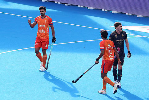 India's Abhishek, left, celebrates after scoring the opening goal during the World Cup Field Hockey, 7th and 8th place playoff match, between Belgium and India in Wavre, Belgium, Friday, Aug. 28, 2026.
