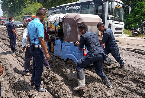 Police personnel push an auto-rickshaw stuck in mud and debris after the flash floods, in Dhading district, Nepal. The death toll from the devastating flash floods in Nepal surged to 626 on Saturday, as rescue teams continued search and relief operations in a race against time. 