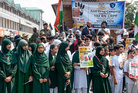 School students hold placards during a 'Nasha Mukt Bharat Abhiyaan' awareness rally against drug abuse at the Ghanta Ghar, in Lal Chowk, Srinagar, Jammu and Kashmir.