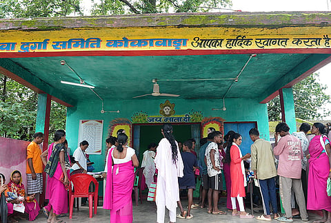 People gather at a mega saturation drive to receive their 'Ayushman Vay Vandana' and 'Aadhaar Redacted' cards from government officials, in Sukma, Chhattisgarh. The camp is part of the state government's efforts to ensure last-mile delivery of essential public services and welfare benefits in remote areas of the region. 