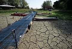 Boats sit on dry ground as water levels have dropped on the Danube River in Petrovaradin, Serbia, Tuesday, Aug. 25, 2026. - | Photo: AP/Darko Vojinovic