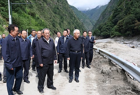 > In this photo released by Xinhua News Agency, Chinese Premier Li Qiang, fifth from left, inspects a mudslide-hit area in southwestern Tibet on Thursday, August 27, 2026.