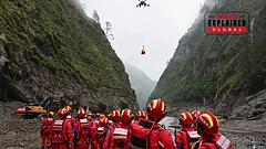 A drone carries cargo overhead as search and rescue operations are underway at the mudslide-hit area in Gyirong County, southwestern China's Tibet Autonomous Region, on Saturday, Aug. 29, 2026. - | Photo: Jiang Fan/Xinhua via AP