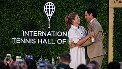 Roger Federer is embraced by his wife Mirka during his induction ceremony at the International Tennis Hall of Fame, Saturday, Aug. 29, 2026, in Newport, R.I. - (AP Photo/Charles Krupa)