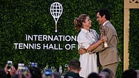 (AP Photo/Charles Krupa) : Roger Federer is embraced by his wife Mirka during his induction ceremony at the International Tennis Hall of Fame, Saturday, Aug. 29, 2026, in Newport, R.I.