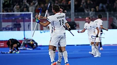 Germany's Justus Weigand, left, celebrates with teammates after Germany won the World Cup Field Hockey semifinal match between Germany and Argentina in Wavre, Belgium, Friday, Aug. 28, 2026. - (AP Photo/Omar Havana)