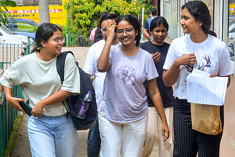 Aspirants leave from an examination centre after appearing in the NEET-PG 2026 examination, in Ranchi.