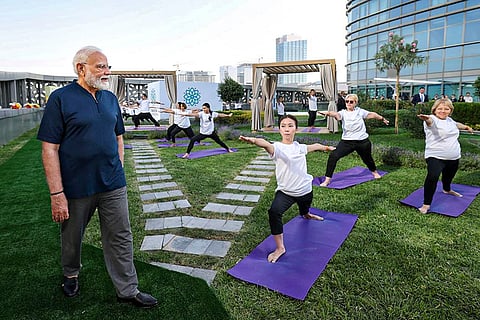 In this image posted on Aug. 30, 2026, Prime Minister Narendra Modi views a yoga session organised by the Yoga Federation of Uzbekistan at the Hilton Tashkent City hotel during his two-day state visit, in Tashkent, Uzbekistan.