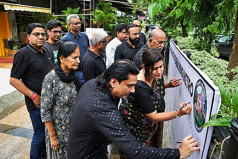 People organize a signature campaign as they protest against the proposed Thane Ring Metro Project, in Thane, Maharashtra.