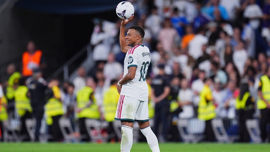 Real Madrid's Kylian Mbappe celebrates after scoring during the La Liga soccer match between Real Madrid and Real Sociedad in Madrid, Spain. - Manu Fernandez/AP Photo