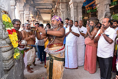 Monks perform rituals during a prayer ceremony after the completion of renovation work of Veera Vasantharaya Mandapam at the Meenakshi Sundareswarar Temple, in Madurai, Tamil Nadu.