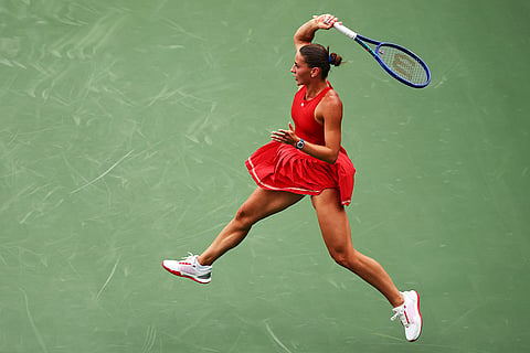 Marta Kostyuk, of Ukraine, competes against Storm Hunter, of Australia, during the first round of the U.S. Open tennis championships in New York.