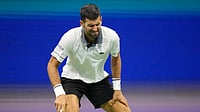 (AP Photo/Frank Franklin II) : Novak Djokovic, of Serbia, reacts during the first round of the U.S. Open tennis championships against Mariano Navone, of Argentina, Sunday, Aug. 30, 2026, in New York