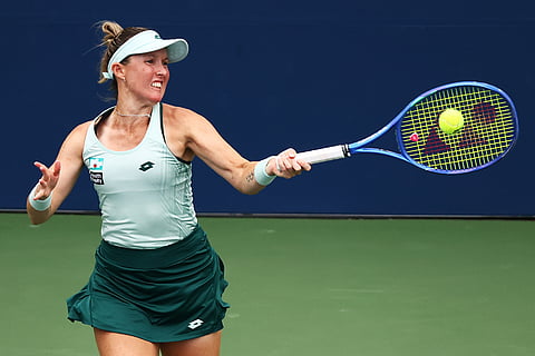 Storm Hunter, of Australia, returns the ball to Marta Kostyuk, of Ukraine, during the first round of the U.S. Open tennis championships in New York.