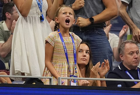 Tara Djokovic, center, reacts as her dad, Novak Djokovic, of Serbia, competes against Mariano Navone, of Argentina, during the first round of the U.S. Open tennis championships Sunday, Aug. 30, 2026, in New York. 