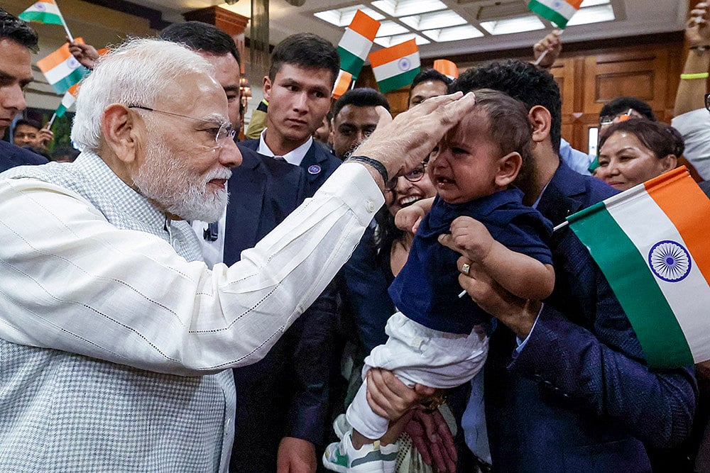 In this image received on Aug. 30, 2026, Prime Minister Narendra Modi being greeted by members of Indian community upon his arrival in Bishkek to participate in the 26th SCO Leadership Summit. - Photo: PMO via PTI 