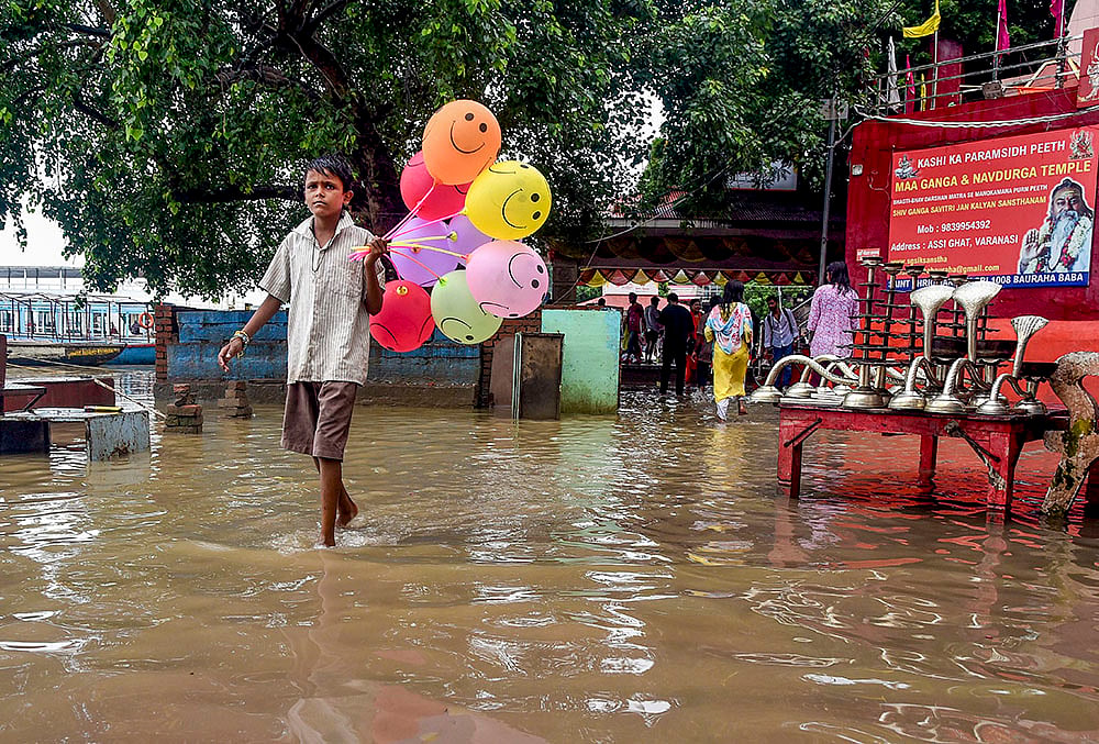 UP flood alert Ganga river rising speed cm per hour
