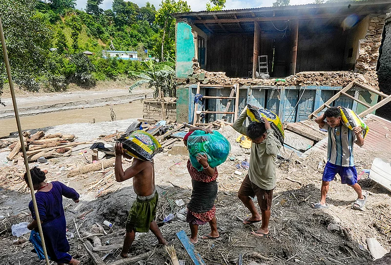 Sifting through mud Dhading Nepa