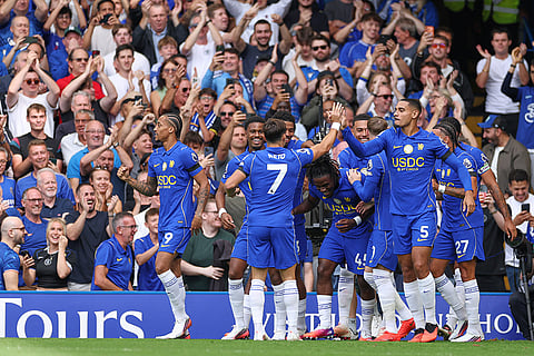 Chelsea players celebrate after Chelsea's Romeo Lavia scored his side's opening goal during the English Premier League soccer match between Chelsea and Brighton and Hove Albion in London.