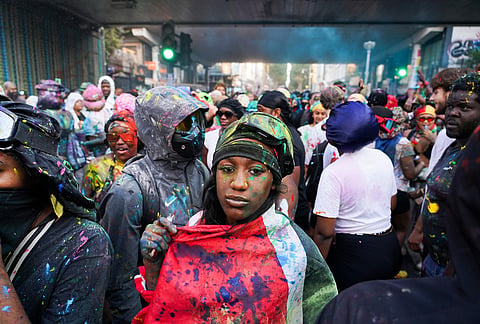 Revellers attend the J'Ouvert, the opening event of the Notting Hill Carnival, in London, Sunday, Aug. 30, 2026. 