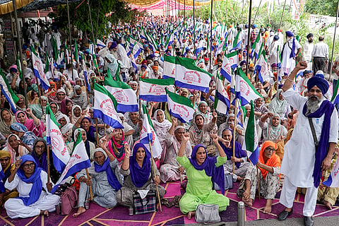 Farmers raise slogans during a statewide, one-day protest organized by the Kisan Mazdoor Morcha outside the Deputy Commissioner's office, in Amritsar, Punjab. Demonstrators gathered across all 22 districts of the state to press both central and state governments on pending demands, including a legal guarantee of Minimum Support Price (MSP), complete debt waivers, and compensation for families of farmers affected during the ongoing agitations.