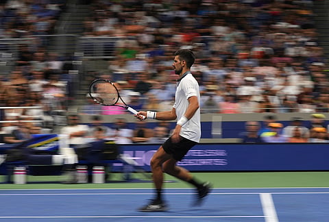Novak Djokovic, of Serbia, runs as he competes against Mariano Navone, of Argentina, during the first round of the U.S. Open tennis championships Sunday, Aug. 30, 2026, in New York. 