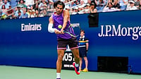 Yuki Iwamura/AP Photo : Carlos Alcaraz, of Spain, returns the ball during a mixed doubles match at the U.S. Open tennis championships, Tuesday.