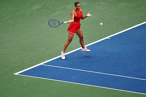 Marta Kostyuk, of Ukraine, returns the ball to Storm Hunter, of Australia, during the first round of the U.S. Open tennis championships in New York.