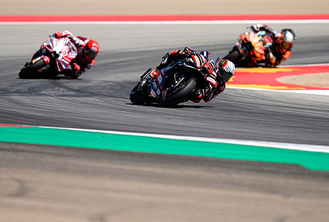 Italian rider Marco Bezzecchi of the Aprilia Racing steers his motorcycle followed by Spain's rider Marc Marquez of the Ducati Lenovo Team and Spain's rider Pedro Acosta of the Red Bull KTM Factory Racing during the MotoGP race of the Grand Prix of Aragon in Alcaniz, Spain, Sunday, Aug. 30, 2026. 