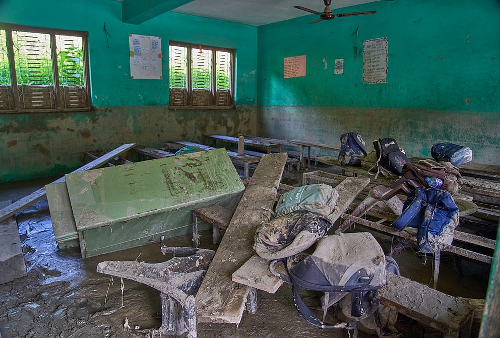 Mud covers the floor of a classroom strewn with furniture damaged in the recent flash floods, at the Shree Bagheswori Madhyamik School in Galchhi, Dhading district of Nepal Sunday, Aug. 30, 2026.  - | Photo: AP/Niranjan Shrestha