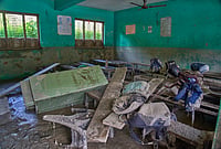 After The Floods: Inside A Nepal School Where Children Escaped Disaster
| Photo: AP/Niranjan Shrestha : Mud covers the floor of a classroom strewn with furniture damaged in the recent flash floods, at the Shree Bagheswori Madhyamik School in Galchhi, Dhading district of Nepal Sunday, Aug. 30, 2026.