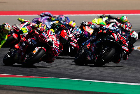 Spain's rider Marc Marquez of the Ducati Lenovo Team, left, steers his motorcycle followed by Italian rider Marco Bezzecchi of the Aprilia Racing during the MotoGP race of the Grand Prix of Aragon in Alcaniz, Spain, Sunday, Aug. 30, 2026.
