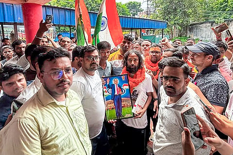 Jharkhand student leader Devendra Nath Mahato holds a portrait of Dr BR Ambedkar during the 'Bharti Vyavastha Sudhar Yatra', in Dhanbad district, Jharkhand. The march aims to highlight widespread irregularities and demand comprehensive reforms in the state's recruitment examination system.