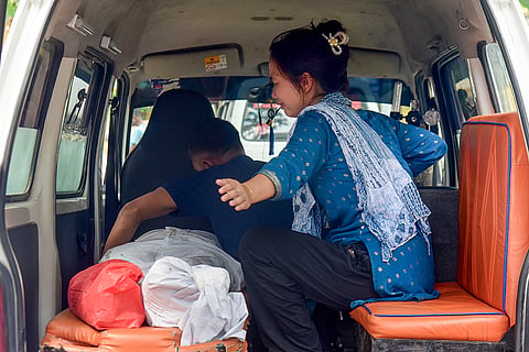 Grieving relatives inside an ambulance with the body of Anima Deka Bordoloi at the Gauhati Medical College and Hospital (GMCH) post-mortem department, in Guwahati, Assam. Bordoloi was among the seven people who tragically lost their lives in a major vehicular accident in Khetri the previous night.