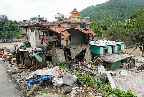 Damaged houses remain covered in mud and silt in the aftermath of the recent flash floods, in Galchhi, Dhading district, Nepal, Sunday, Aug. 30, 2026. 