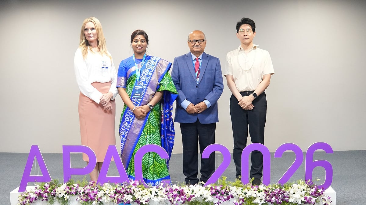 Dr. Shree Rao standing alongside international delegates on stage at APAC 2026 - null