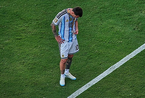 Argentina's Lionel Messi (10) checks his runners-up medal after the World Cup final soccer match between Spain and Argentina in East Rutherford, N.J., near New York, July 19, 2026.