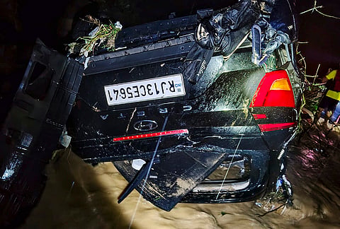 Damaged remains of a car recovered during a rescue operation after it was swept away by strong rainwater near Kandoli Bridge on Poundha Road in the Lower Kandoli area under Prem Nagar Police Station, in Dehradun.
