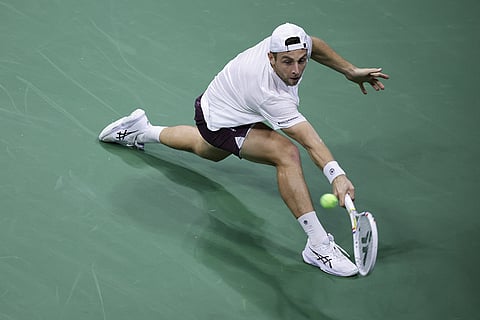 Tallon Griekspoor, of the Netherlands, returns the ball to Ben Shelton, of the United States, during the first round of the U.S. Open tennis championships in New York.